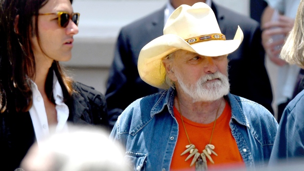 FILE - Dickey Betts, a founding member of the Allman Brothers Band, exits the funeral of Gregg Allman at Snow's Memorial Chapel, June 3, 2017, in Macon, Ga. (Jason Vorhees / The Macon Telegraph via AP, File)