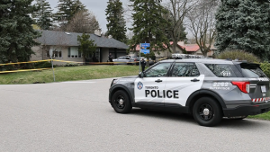 Police are shown at the scene of a fatal stabbing at a home in Etobicoke on Thursday afternoon. (CP24)