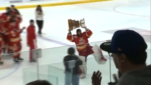 Calgary Canucks are the 2024 AJHL champions after defeating Whitecourt 3-2 Wednesday night. Goaltiender Julian Molinaro celebrates after the game.