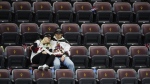 Arizona Coyotes fans sit in their seats long after the team's NHL hockey game on April 17, 2024. (Ross D. Franklin/AP Photo)