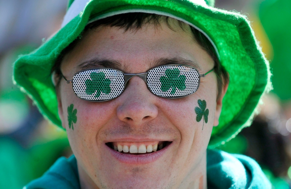 A member of the crowd enjoys the festivities at the 185th consecutive St. Patrick's Day parade in Montreal Sunday, March, 22, 2009. THE CANADIAN PRESS/Graham Hughes