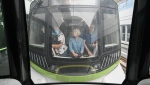 People take a ride on the Reseau express metropolitain (REM) light rail system in Montreal, Saturday, July 29, 2023. The REM opens Monday to fare paying passengers. THE CANADIAN PRESS/Graham Hughes