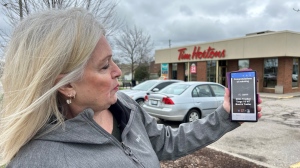 Sandra O’Connell from Waterloo shows the email she received Wednesday morning claiming she won a boat through Tim Hortons Roll Up To Win promotion. (Heather Senoran/CTV News)