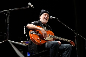 Canadian rock legend Randy Bachman sings a song with his Gretsch guitar, which was once stolen, after he was reunited with it during the Lost and Found Guitar Exchange Ceremony, Friday, July 1, 2022, at Canadian Embassy in Tokyo. (Eugene Hoshiko/AP Photo)
