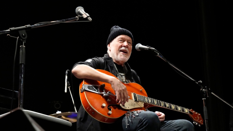 Canadian rock legend Randy Bachman sings a song with his Gretsch guitar, which was once stolen, after he was reunited with it during the Lost and Found Guitar Exchange Ceremony, Friday, July 1, 2022, at Canadian Embassy in Tokyo. (Eugene Hoshiko/AP Photo)