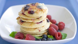 This March 26, 2012 file photo shows a plate of pancakes with blueberries and granola mixed in the batter in Concord, N.H.  (AP Photo/Matthew Mead, File)