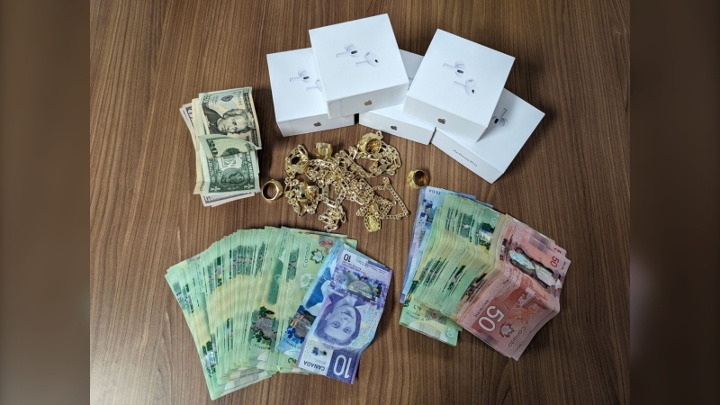 Ontario Provincial Police say officers seized $3,116 in cash, fake gold jewelry and counterfeit Apple Air Pods during an investigation in Quinte West.