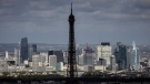 The Eiffel Tower is seen, with the business district La Defense in background, Monday, April 15, 2024 in Paris. (AP Photo/Aurelien Morissard)