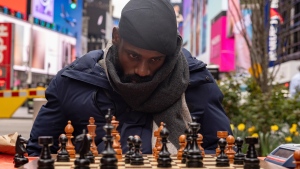 Tunde Onakoya, a Nigerian chess champion and child education advocate, plays a chess game in Times Square, Friday, April 19, 2024, in New York. (Yuki Iwamura / AP Photo)