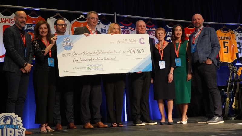 Officials from the Play for a Cure Pro-Am present a $404,000 cheque on to support local cancer research in Windsor-Essex through the Cancer Research Collaboration Fund on April 20, 2024. (Bob Bellacicco/CTV News Windsor)