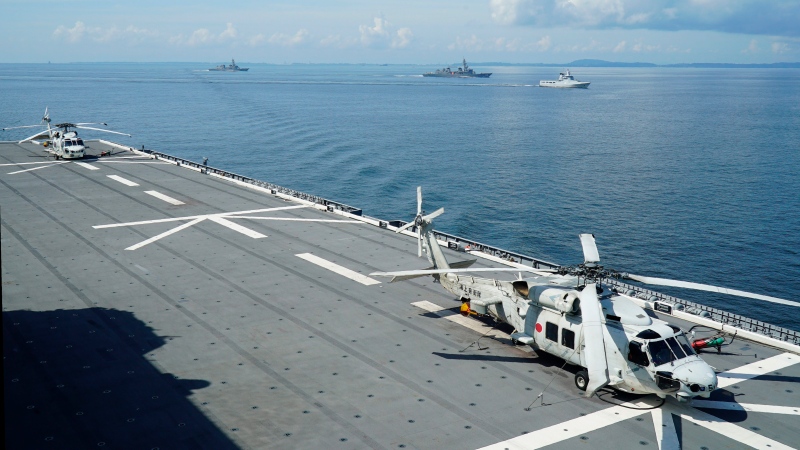 In this June 26, 2019, photo, two SH-60K anti-submarine helicopters stand by on the flight deck of Japan's Maritime Self Defense Force (JMSDF) helicopter carrier JS Izumo (DDH-183). (AP Photo/Emily Wang)