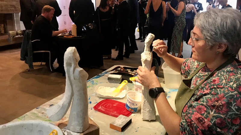 Neda MAzhab Jafari, a sculptor from Barrie, creating live art for auction at the Gala on April 20, 2024 (David Sullivan/CTV News). 