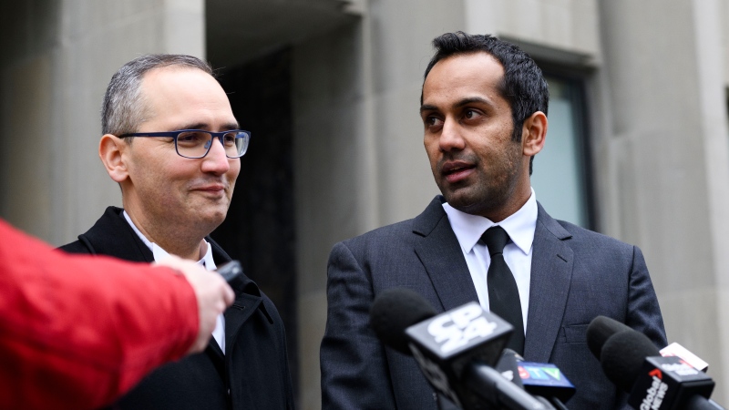 Umar Zameer thanks defence lawyer Nader Hasan while speaking to members of the media outside the courthouse following his not guilty verdict, in Toronto, Sunday, April 21, 2024. THE CANADIAN PRESS/Christopher Katsarov 