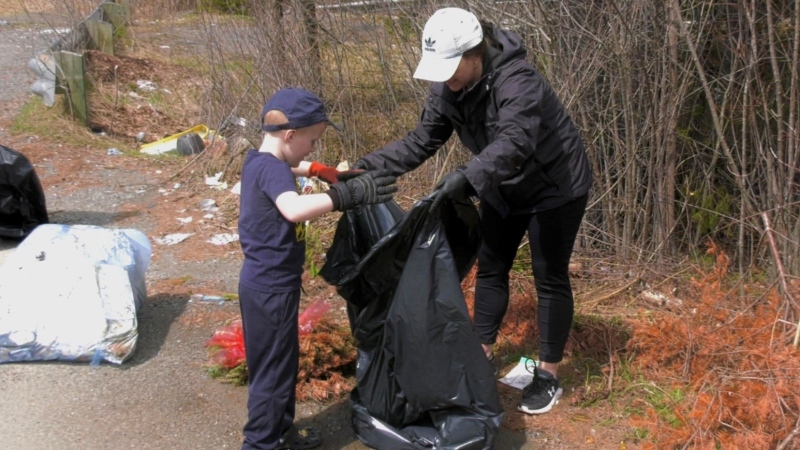 Volunteers participate in a community cleanup in St. Stephen, N.B. on April 21, 2024. (CTV/Nick Moore)