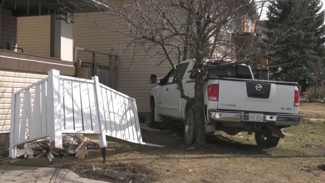 A truck crashed into a home in the 0 to 100 block of Bridlecrest Blvd S.W. in Calgary on April 21, 2024. (Tyler Barrow/CTV News Calgary) 