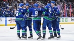 Vancouver Canucks celebrate Dakota Joshua's second goal against the Nashville Predators during the third period in Game 1 of an NHL hockey Stanley Cup first-round playoff series, in Vancouver, on Sunday, April 21, 2024. THE CANADIAN PRESS/Darryl Dyck
