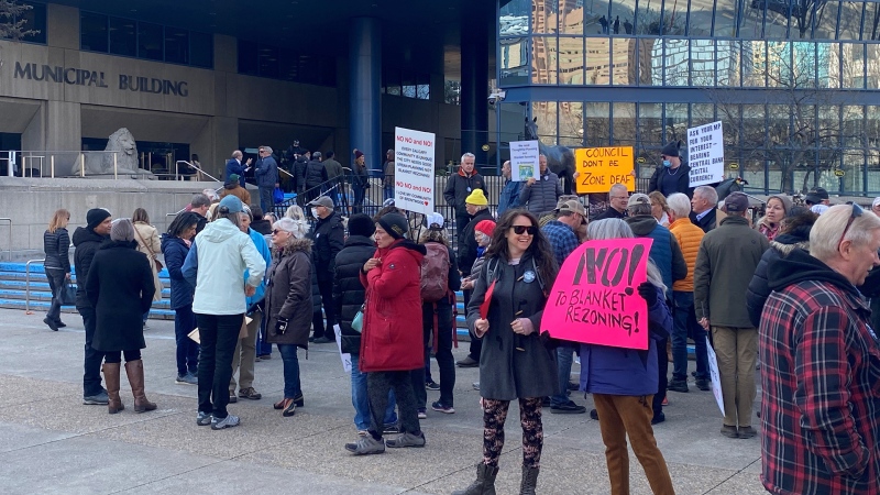As of 9:30 a.m., several dozen protesters were gathered outside Calgary city hall to voice their disappointment with a proposed plan to rezone the city to allow row homes and duplexes pretty much anywhere.