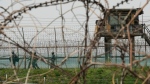 South Korean army soldiers pass by the barbed-wire fence in Paju, South Korea, near the border with North Korea, Friday, April 19, 2024. (AP Photo/Ahn Young-joon)