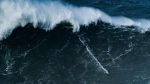 Steudtner surfs the 86-foot wave in Nazaré, Portugal in February. (Quattro Media via CNN Newsource)