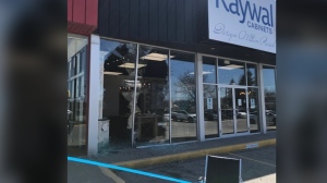Shattered glass could be seen at a Cambridge business after a crash on April 22, 2024. (CTV News/Dave Pettitt)