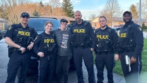 Brian Gray-Hicks surrounded by the Huron OPP officers who helped locate him after he went missing on April 16, 2024 in Clinton. (Source: Huron OPP) 