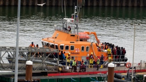 A group of people thought to be migrants are brought into Dover, Kent, by the Border Force following a small boat incident in the English Channel, on Tuesday, April 23, 2024. (Gareth Fuller/PA via AP)