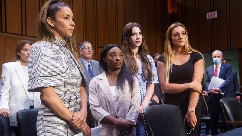 Gymnasts Aly Raisman, Simone Biles, McKayla Maroney and Maggie Nichols pictured at a Senate Judiciary hearing about the FBI's handling of the Larry Nassar investigation, Sept. 15, 2021, in Washington. (Saul Loeb/Pool via AP)
