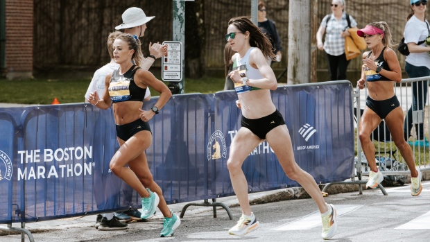 Kim and Michelle Krezonoski are seen running the Boston Marathon on April 15, 2024. (Supplied) 