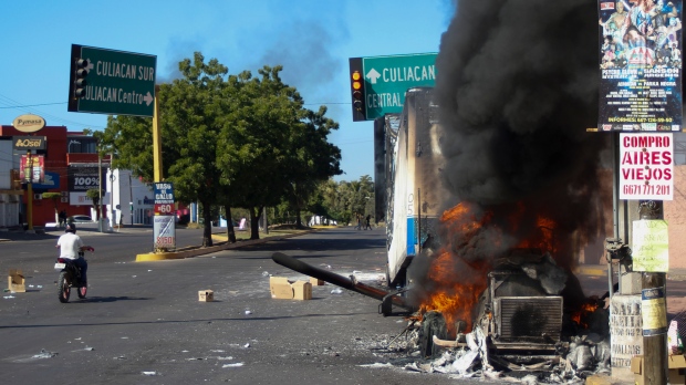 A truck burns in Culiacan, Sinaloa state, Mexico, on Jan. 5, 2023, when the government detained the son of imprisoned drug lord Joaquin 'El Chapo' Guzman (Martin Urista /AP Photo/  File)
