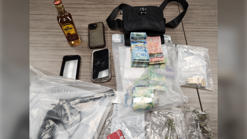 Police said a search of the suspect's vehicle uncovered a handgun, credit cards, Canadian currency, open liquor and drugs suspected to be cannabis. (OPP photo)