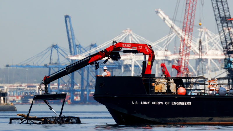 The U.S. Army Corps of Engineers debris removal vessel The Reynolds works near the collapsed Francis Scott Key Bridge, Monday, April 15, 2024, in Baltimore. (Julia Nikhinson / AP Photo)