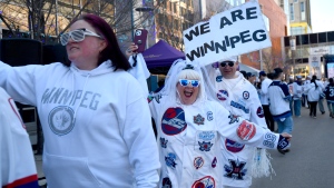 Winnipeg Jets fans arrive for a street party outside the arena prior to Game 1 of the NHL hockey Stanley Cup first-round playoff series against the Colorado Avalanche in Winnipeg, Sunday April 21, 2024. (Fred Greenslade / The Canadian Press)