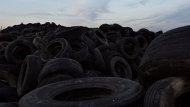 Millions of used tires lay stored on a dump in Sesena, south of Madrid, Spain, Tuesday, Sept. 30, 2014. (AP Photo/Daniel Ochoa de Olza)