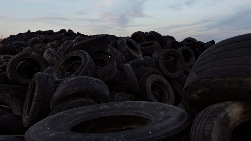 Millions of used tires lay stored on a dump in Sesena, south of Madrid, Spain, Tuesday, Sept. 30, 2014. (AP Photo/Daniel Ochoa de Olza)