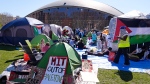 Students protest at an encampment outside the Kresge Auditorium on the campus of the Massachusetts Institute of Technology, Tuesday, April 23, 2024, in Cambridge, Mass. (AP Photo/Charles Krupa) 