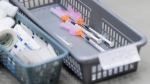 A basket of needles containing COVID-19 vaccines waits to be administered to patients at a COVID-19 clinic in Ottawa on March 30, 2021. THE CANADIAN PRESS/Sean Kilpatrick