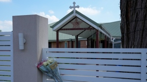 Flowers sit on a fence outside the Christ the Good Shepherd church in western Sydney, Australia, on April 16, 2024. (AP Photo/Mark Baker, File)