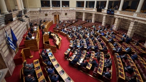 Lawmakers attend a parliament session in Athens, Greece, Thursday, March 28, 2024. (AP Photo/Petros Giannakouris) 