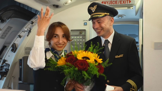 A captain proposed to a flight attendant aboard a flight to Kraków, Poland. (LOT Polish Airlines / Facebook / CNN Newsource)