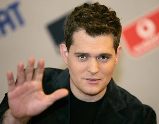 Canadian pop singer Michael Buble waves prior to meeting the media, in San Remo, Italy, Tuesday, March 1, 2005. (CP / AP / Luca Bruno)