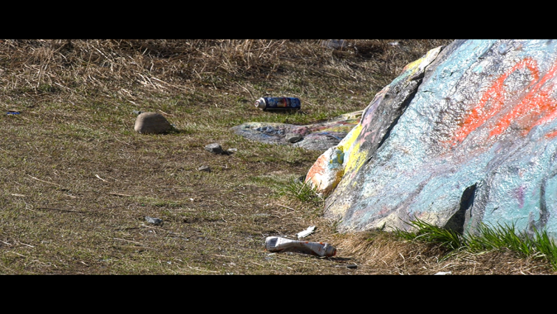 Today the rock is covered in countless layers of paint, with fresh cans on the ground as of April 22, 2024. 