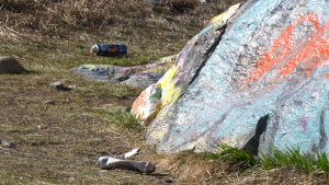 Today the rock is covered in countless layers of paint, with fresh cans on the ground as of April 22, 2024. 