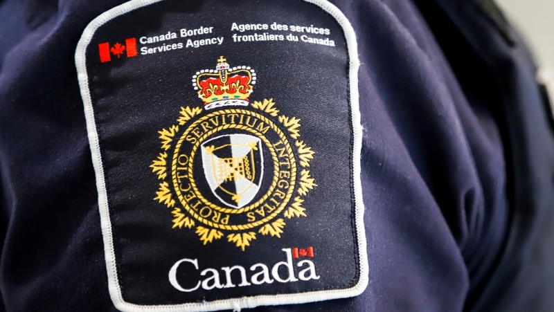 A Canada Border Services Agency patch is seen on an officer in Calgary, Alta., Thursday, Aug. 1, 2019. (THE CANADIAN PRESS/Jeff McIntosh)