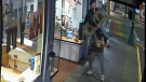 The video, captured on NYLA Fresh Thread cameras, shows a man hoist another man onto his shoulders outside the shop shortly after 2 a.m. The elevated man works to unfasten the store's overhead sign before the weight of it topples him straight to the ground. (Leon Drzewiecki)