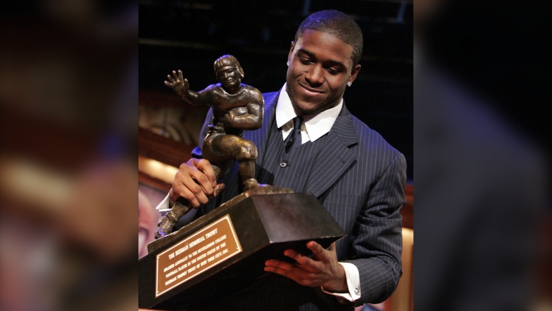 Former USC and NFL running back Reggie Bush is seeing the Heisman Trophy, which he won in 2005, returned to him. (Julie Jacobson / AP / FILE via CNN Newsource)