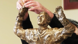 Father Les Costello, the late Catholic priest who played for the Toronto Maple Leafs and was a teammate of Bill Barilko, was honoured Wednesday with a statue in his hometown of Timmins. (Photo from video)