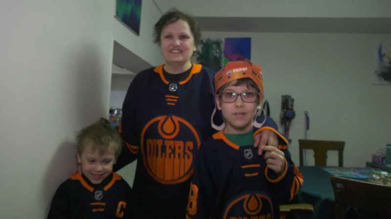 Amanda Ginn and her two sons, Adrian and Alex, wear Edmonton Oilers jerseys to cheer on the team during the 2024 NHL playoffs. (Matt Marshall/CTV News Edmonton)
