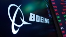 FILE - The logo for Boeing appears on a screen above a trading post on the floor of the New York Stock Exchange, Tuesday, July 13, 2021. (AP Photo/Richard Drew, file)