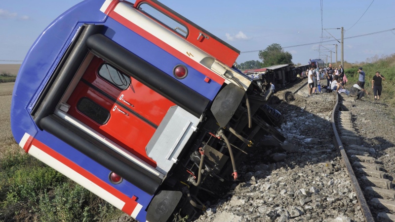 An overturned train car is seen near a village at Tekirdag province, Turkey on July 8, 2018. (Mehmet Yirun/DHA-Depo Photos via AP)