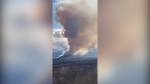 Smoke from a wildfire is seen near Chetwynd, B.C.